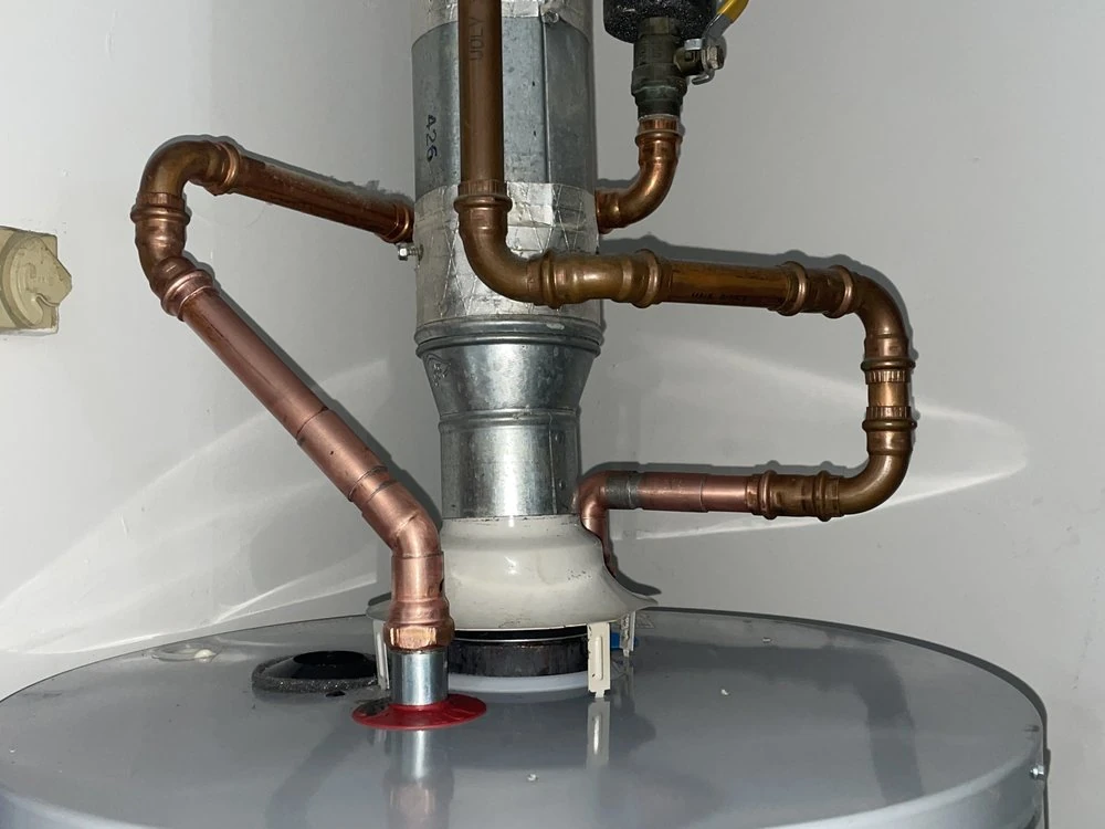 Plumbing pipework and drain connection at a service visit